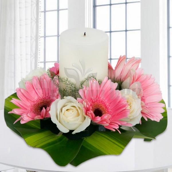 1 White Pillar Candle with 4 White Roses and 5 Pink Carnations and Leaves.